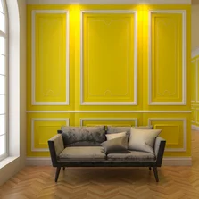 Gestaltungsreich - Wohnzimmer mit weißen Zierprofilen an der gelben Wand